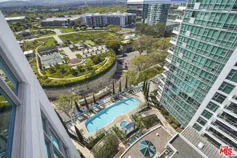 a view of a multi story building with a yard