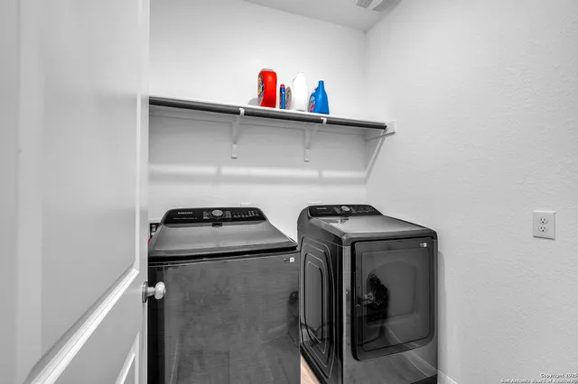 a utility room with dryer and washer