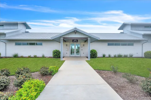 a view of a yard in front of a house