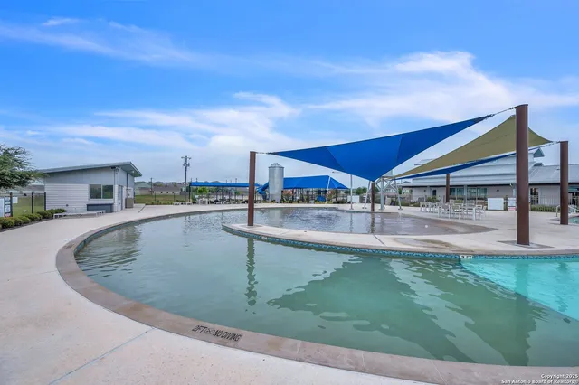 a view of swimming pool with a yard