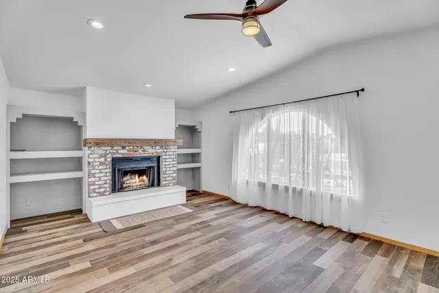 a kitchen with a sink stove top oven and cabinets