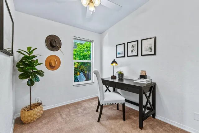 a table room with furniture and potted plant