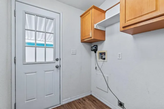a view of a swimming pool with a patio and a yard