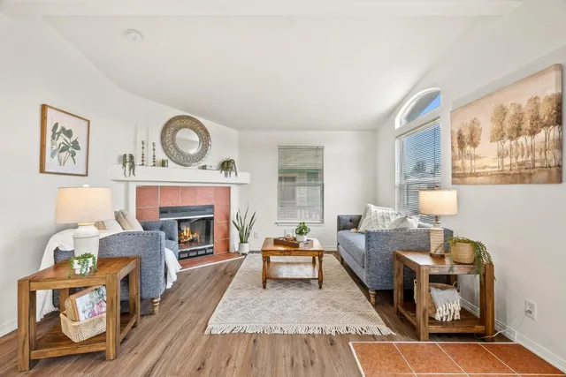 a living room with furniture and a fireplace