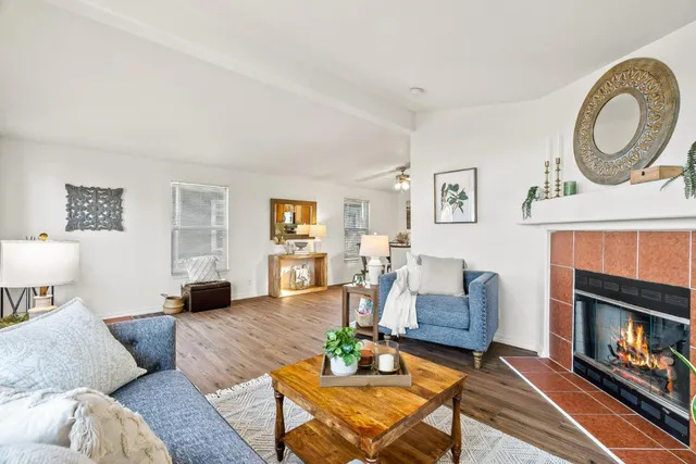 a living room with furniture and a fireplace