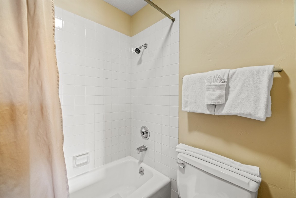 2015 Walton Creek Road, Unit 105 Steamboat Springs, CO 80487 - Photo 16 of 34 a bathroom with a bathtub and toilet