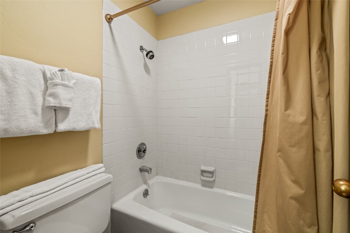 2015 Walton Creek Road, Unit 105 Steamboat Springs, CO 80487 - Photo 20 of 34 a bathroom with a bathtub and shower