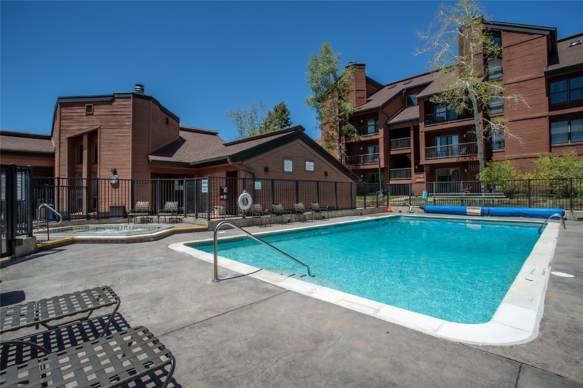 2015 Walton Creek Road, Unit 105 Steamboat Springs, CO 80487 - Photo 27 of 34 a view of a house with swimming pool