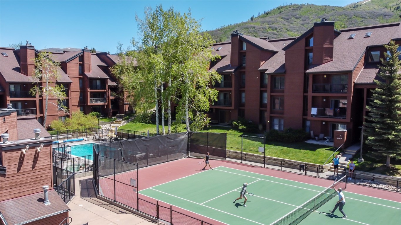 2015 Walton Creek Road, Unit 105 Steamboat Springs, CO 80487 - Photo 31 of 34 a view of a chairs and table in the patio