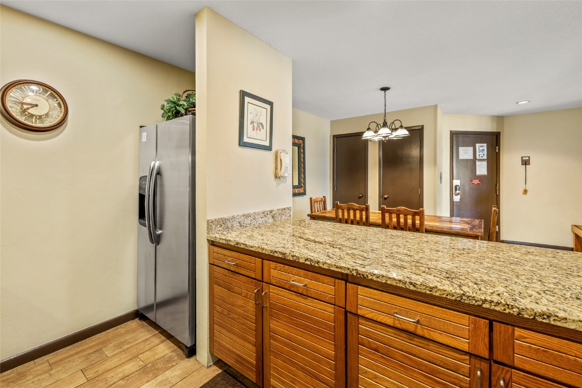 2015 Walton Creek Road, Unit 105 Steamboat Springs, CO 80487 - Photo 9 of 34 a bathroom with a granite countertop sink and a mirror