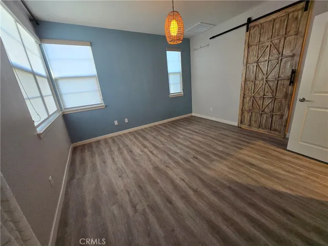 a spacious bathroom with a mirror and a shower