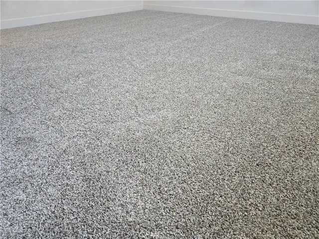 a front view of multiple houses with yard