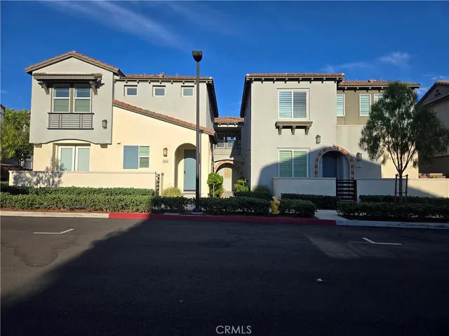 a view of a potted plants on a sidewalk