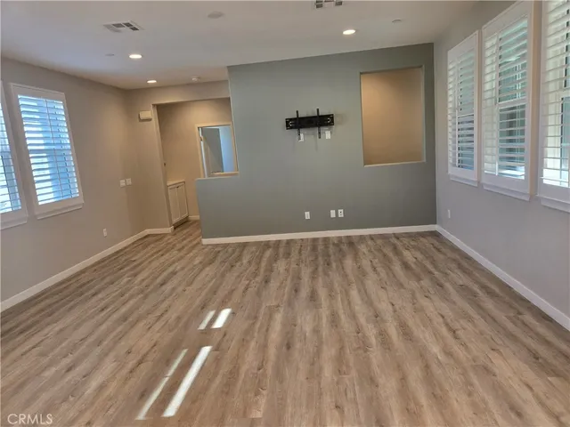 a kitchen with a sink and a refrigerator