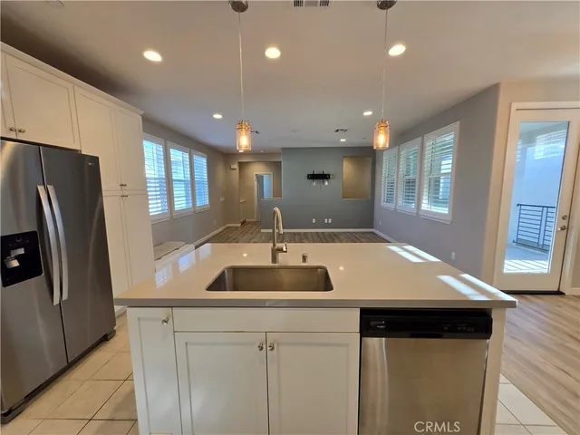 a room with lots of wooden furniture and glass door