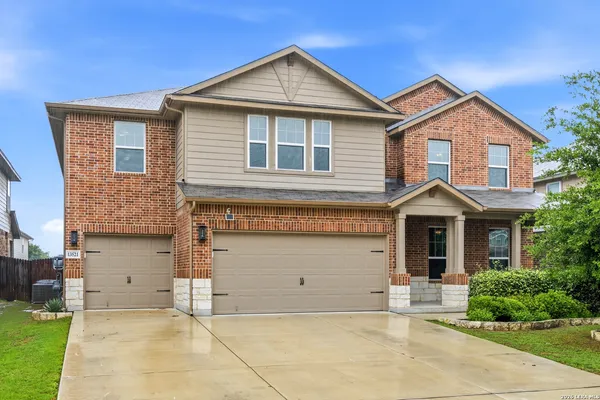 a front view of a house with garage