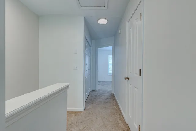 a view of a hallway with closet