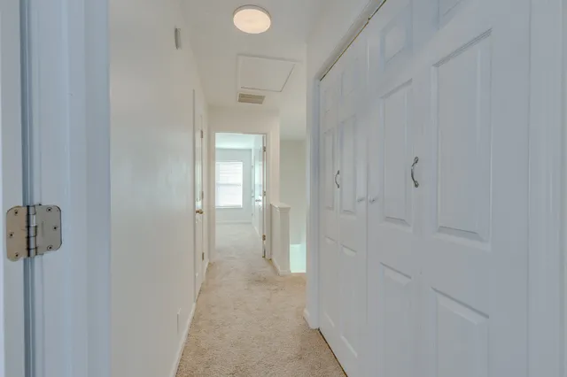 a view of a bathroom from a hallway