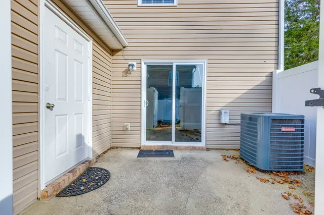 a view of a house with a door and wooden floor