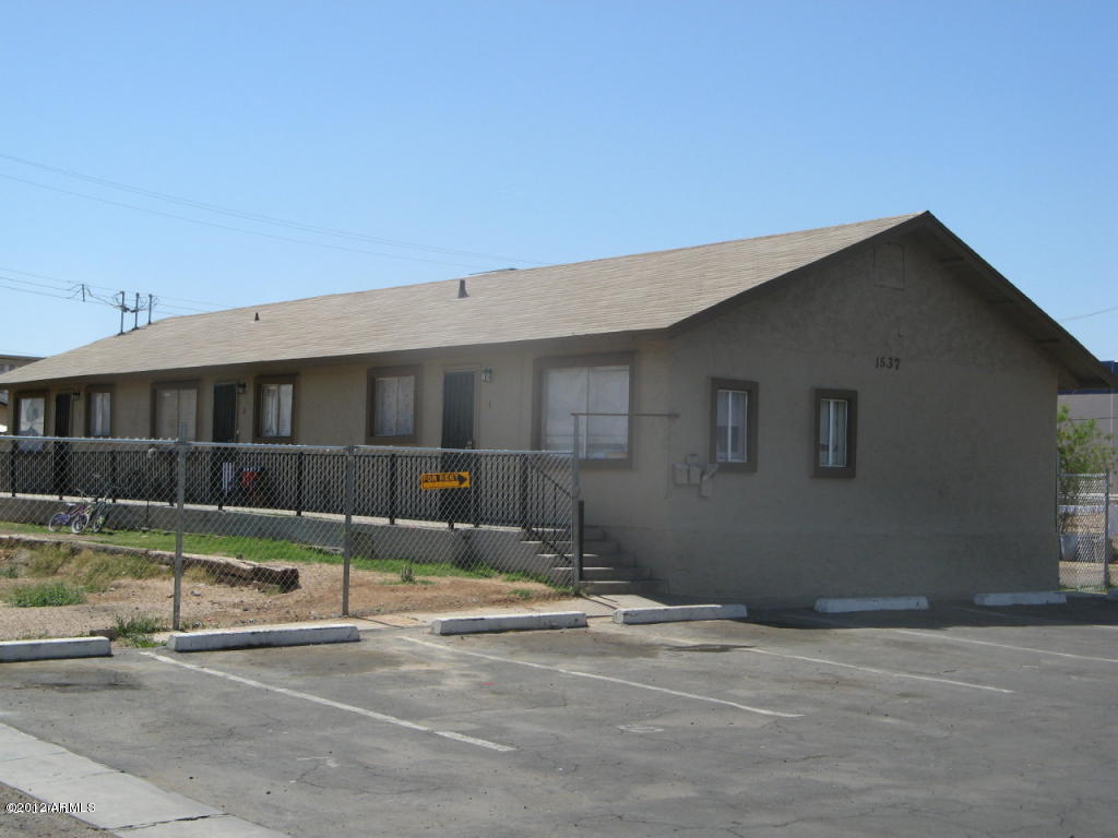 a view of pool with a yard