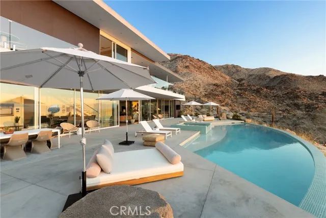 a view of a swimming pool with a patio