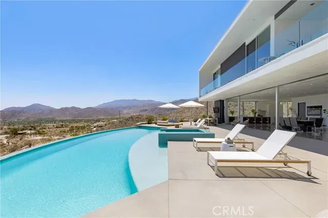 a view of a patio with a table and chairs