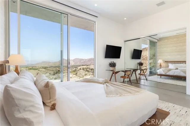 a bathroom with a double vanity sink toilet and shower