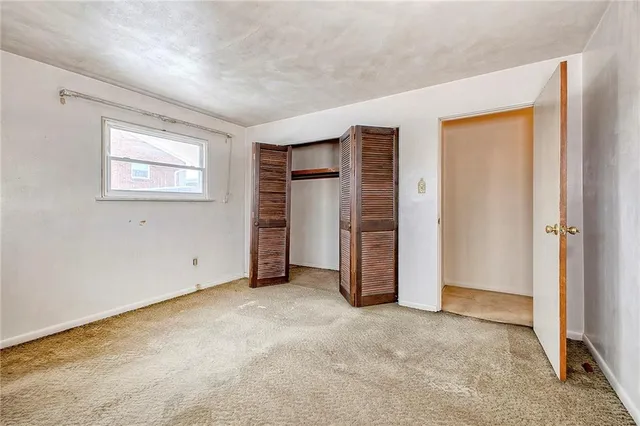 a bathroom with a sink a toilet mirror and vanity
