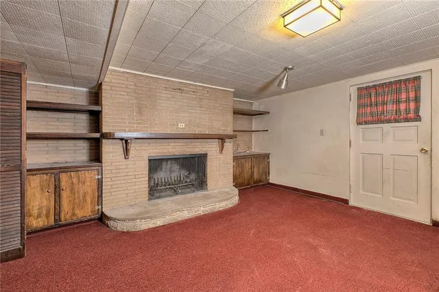 a bathroom with a shower and a sink