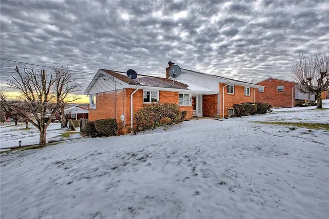 a front view of a house with glass windows