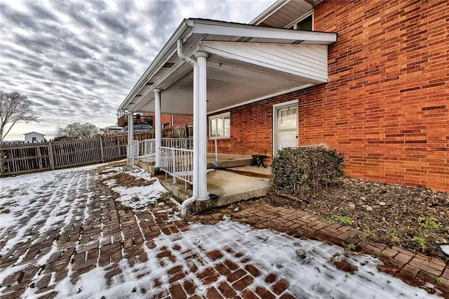a room with a bed and a table in it