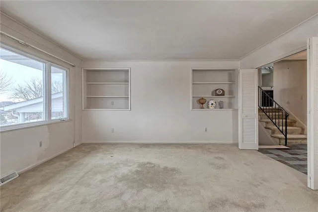 an empty room with windows