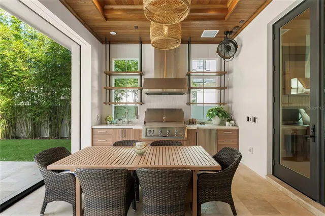 a dining room with a large window and table