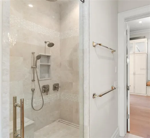 a bathroom with a glass shower door