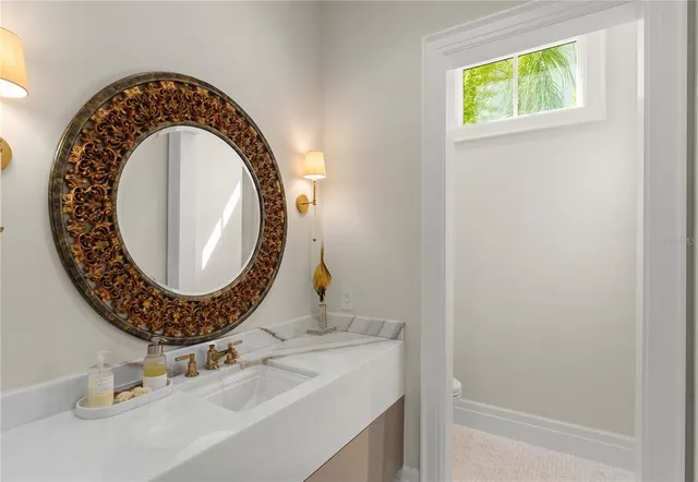 a bathroom with a sink and a mirror