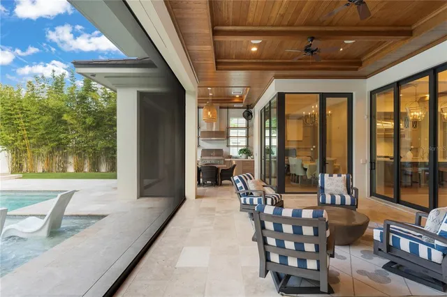a lobby with furniture and large windows
