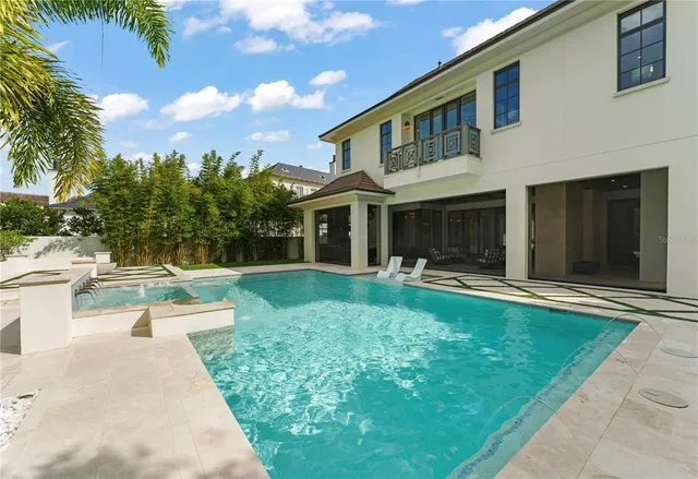 a front view of house with yard and outdoor seating
