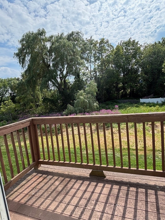 241 Broadway Road, Unit 53 Dracut, MA 01826 - Photo 13 of 24 a view of a black and white deck