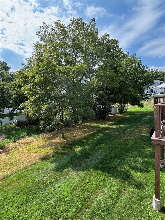 241 Broadway Road, Unit 53 Dracut, MA 01826 - Photo 21 of 24 a view of green field with trees in the background