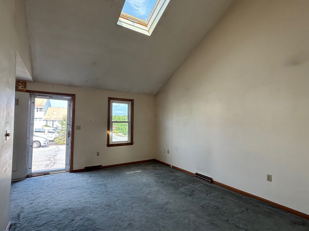 241 Broadway Road, Unit 53 Dracut, MA 01826 - Photo 7 of 24 an empty room with windows