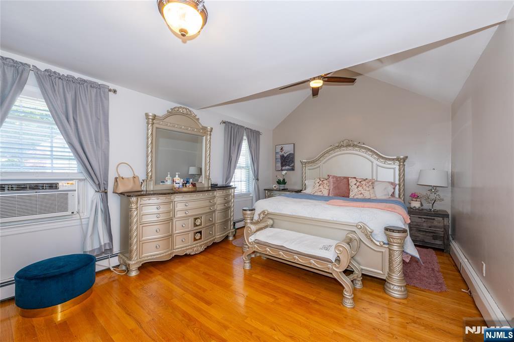 690 Garden Street Maywood, NJ 07607 - Photo 30 of 49 a bedroom with a bed and window