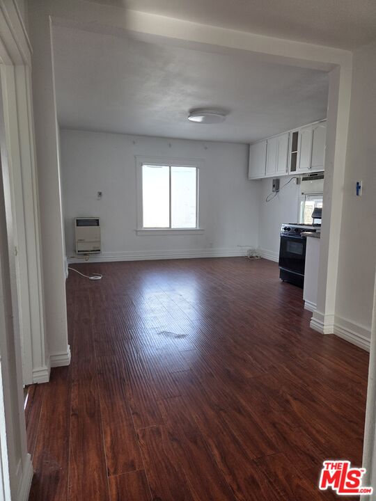 1612 Arlington Avenue Los Angeles, CA 90019 - Photo 16 of 24 a view of empty room with kitchen and window