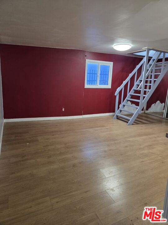 1612 Arlington Avenue Los Angeles, CA 90019 - Photo 22 of 24 a view of an empty room with stairs
