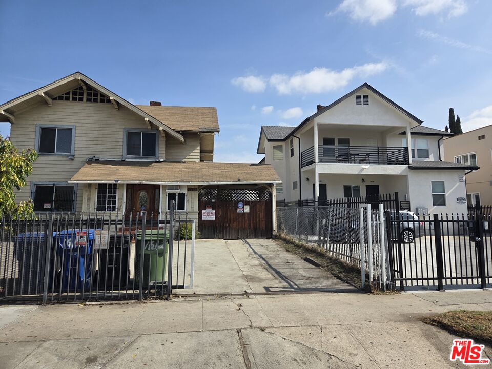 1612 Arlington Avenue Los Angeles, CA 90019 - Photo 3 of 24 a front view of a house with a porch