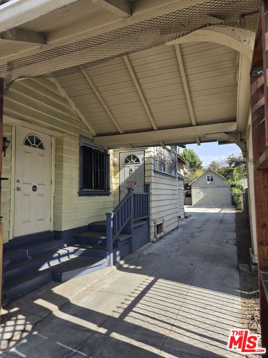 1612 Arlington Avenue Los Angeles, CA 90019 - Photo 4 of 24 a front view of a house with a yard