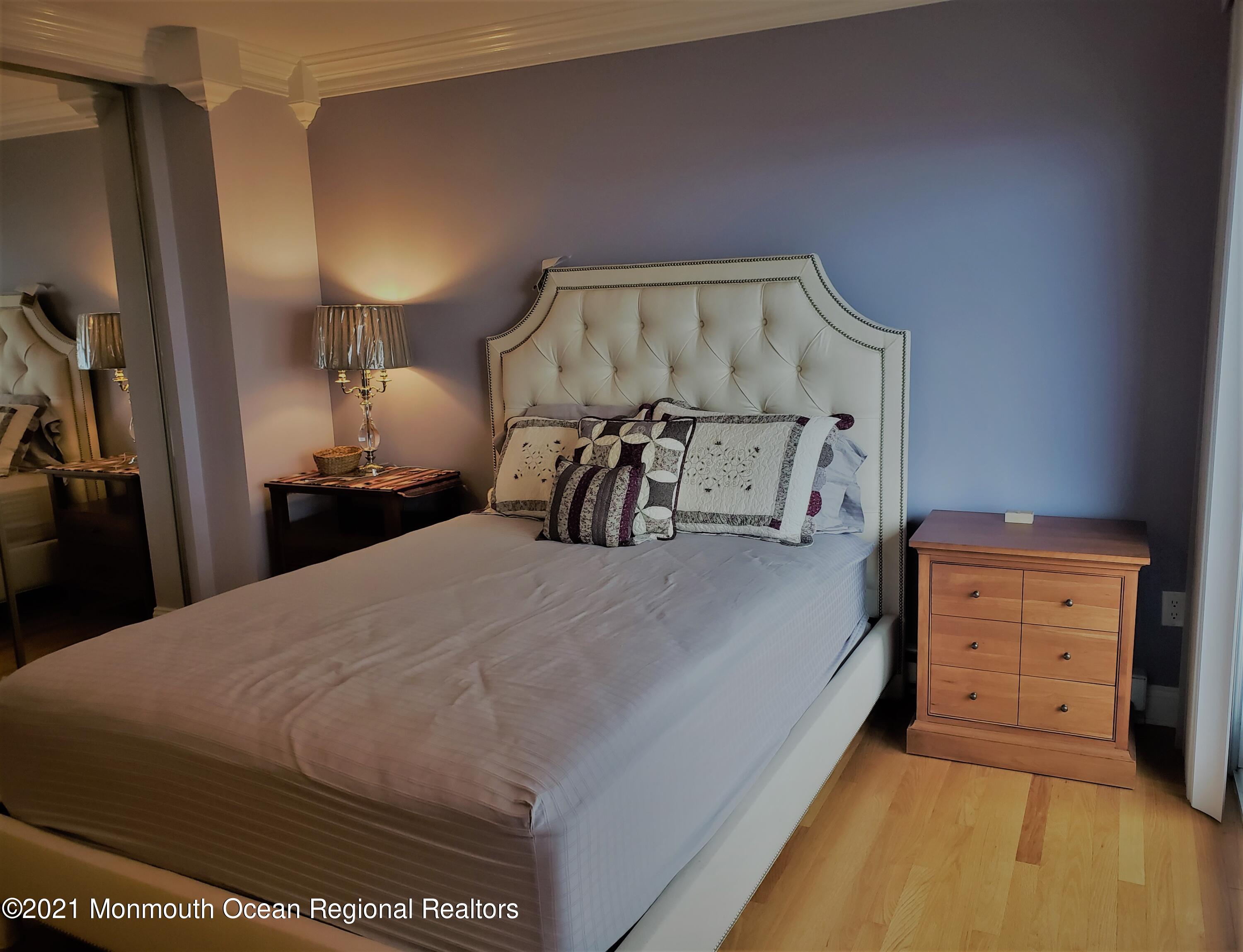 164 Linden Avenue, Unit 12 Highlands, NJ 07732 - Photo 6 of 8 a bedroom with a bed and a closet