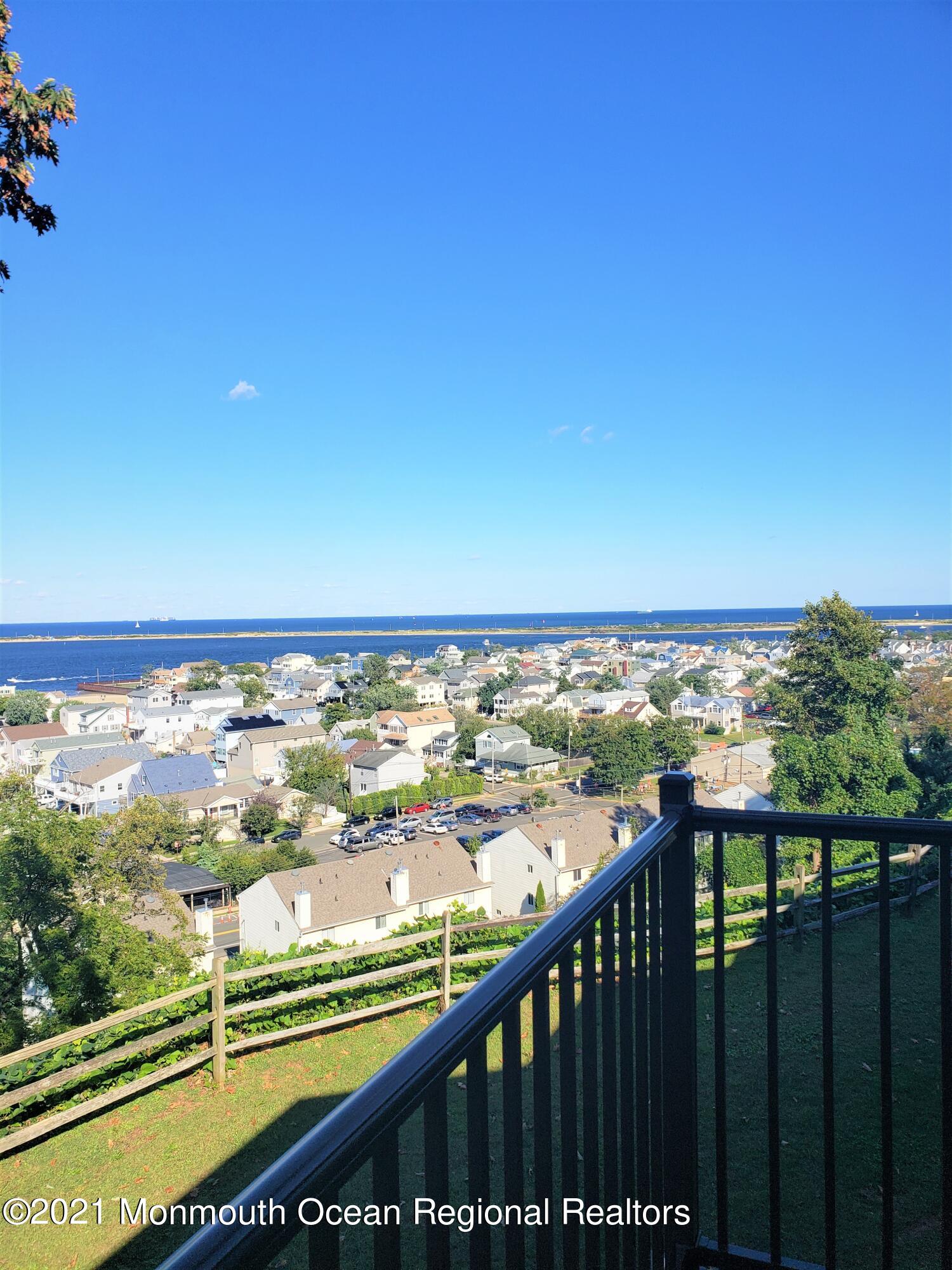 164 Linden Avenue, Unit 12 Highlands, NJ 07732 - Photo 8 of 8 a view of a city from a balcony