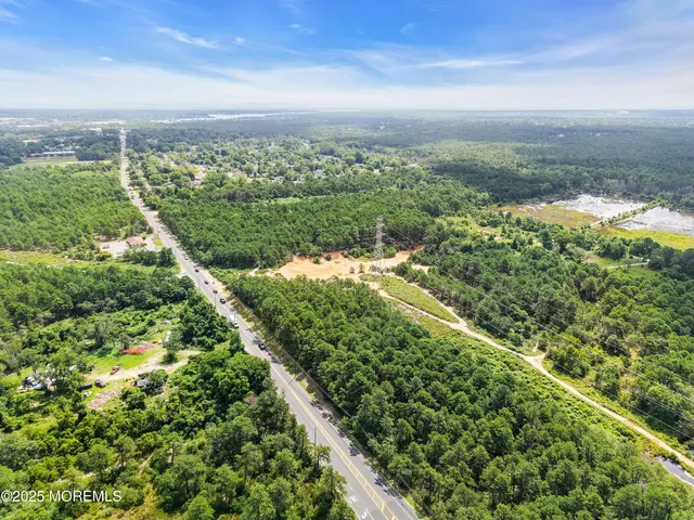 a view of a yard with an ocean view