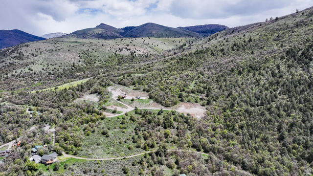 916 North Bonneville Road Preston, ID 83263 - Photo 18 of 37 Aerial view of a mountain backdrop and a heavily wooded area