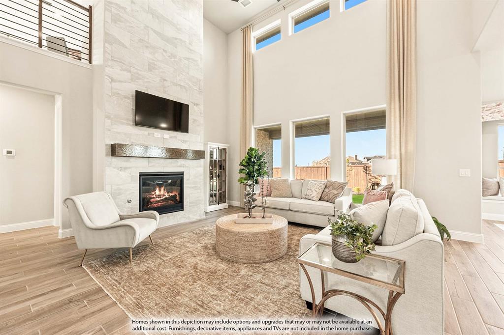 5422 Rutherford Drive Midlothian, TX 76065 - Photo 13 of 36 a living room with furniture a fireplace and a flat screen tv